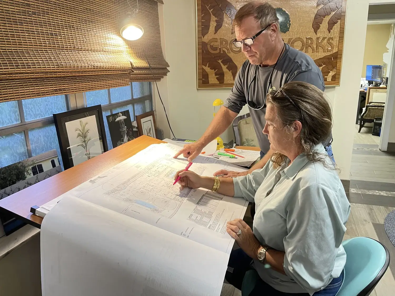 Groundworks president and vice president reviewing palm plans